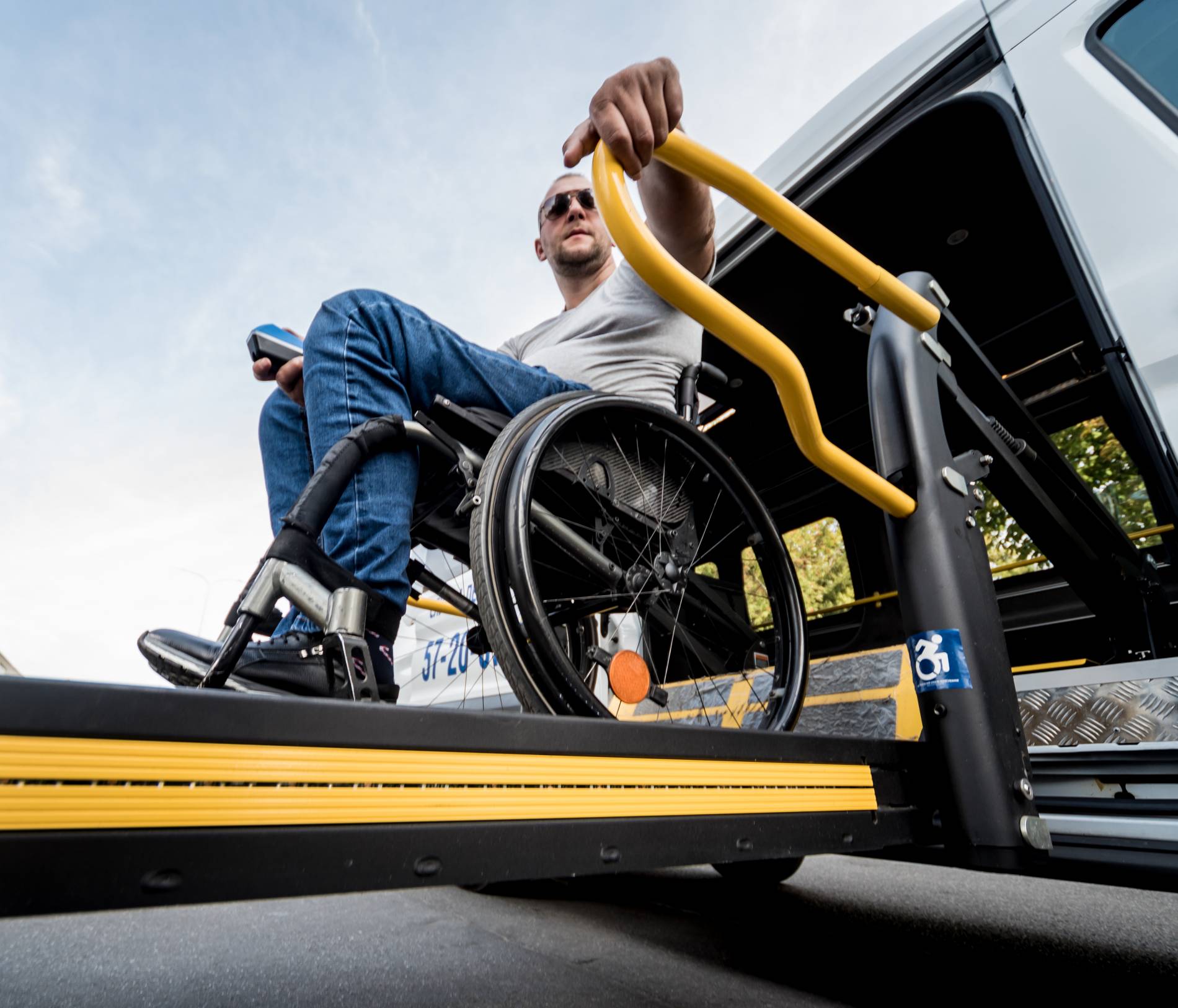 man-wheelchair-lift-specialized-vehicle-people-with-disabilities_1900x1626